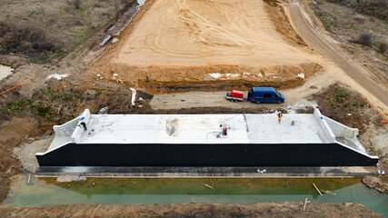 Aerial Perspective.  Construction Site with Workers on Bridge Under Construction