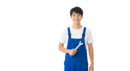 Smiling asian mechanic holding wrench in blue overalls ready for automotive repair service job today on transparent background