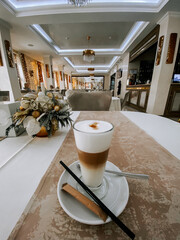 Elegant coffee drink on a table inside a stylish cafe during the afternoon