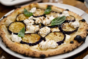 Delicious pizza with eggplant, ricotta cheese, and fresh basil