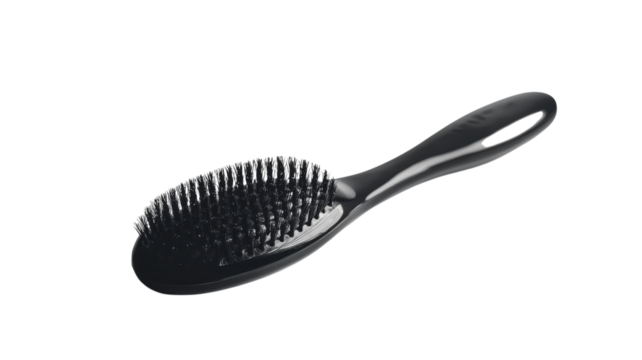Innovative design and flexibility of a sleek black hairbrush suitable for all hair types, showcasing functionality and style in an everyday essential on transparent background