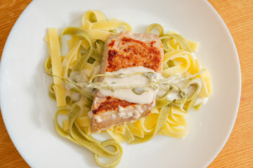 Tuna steak with pasta on plate