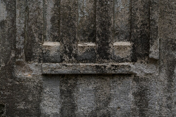 The design of an old, shabby, dirty column. The column in close-up
