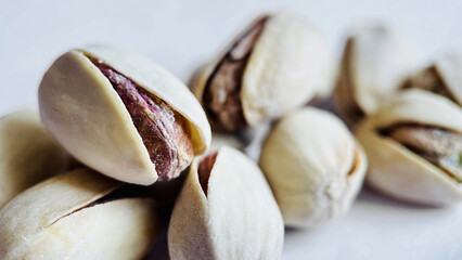 Cracked Pistachios Highlighting Unique Kernel Texture on a Soft Light Background