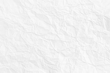 Full frame crumpled white paper texture, showcasing wrinkled surface details, perfect as a background or abstract design element.