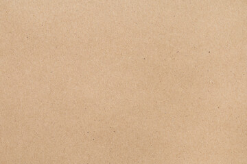 Full frame plain brown kraft paper texture background, ideal for packaging, eco-friendly themes, or rustic designs.