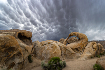 The Mobius Arch in the Alabama hills with awesome mammatus clouds in the sky.