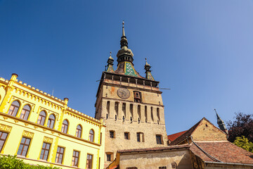Fototapeta premium Clock Tower in Historic Sighisoara, Mures County, Romania – Medieval Landmark and Cultural Heritage 