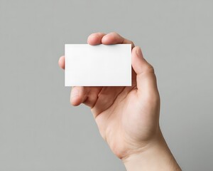 Blank business card held in hand