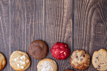 Assorted cookies over wooden table with copy space