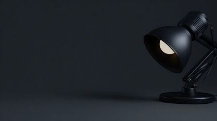 Black desk lamp in dark studio
