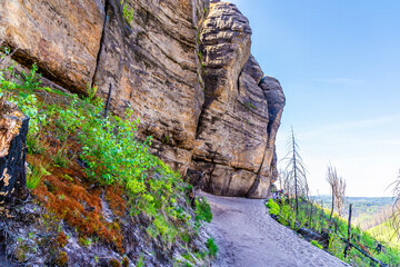 A view along the rock face beside the middle section of the path leading to the Pravcicka Gate arch...