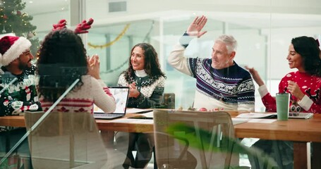 Christmas, achievement and group with laptop, high five or excited for bonus, win or festive season. Happy, colleagues and people with success in office, meeting and cheering for financial growth - Powered by Adobe