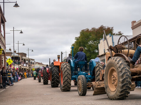 Row of tractors in a street parade