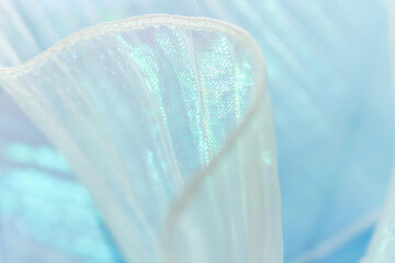 Delicate light blue and white sheer fabric with pleated texture, ideal for haute couture, bridal...