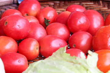 Ripe tomatoes in a fresh vegetable shop
