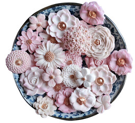 Sam Pan Nee, Thai dessert in pastel pink color tone with various flower shaped, Coconut milk flavor taste, Authentic Thai traditional handcraft snack, isolated cutout transparent background