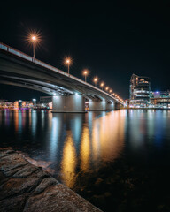 Fototapeta premium Night Shot Illuminated City Bridge with Reflections