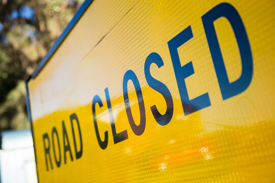 Close up of a road closed sign
