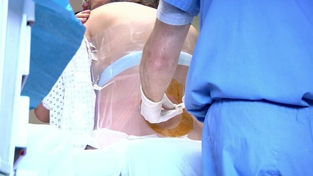 Woman getting an epidural in hospital 