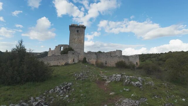 Exploring majestic ancient stone castle against blue sky
