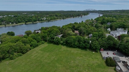 Aerial of Cape Cod Canal with Bourne Bridge crossing. Canal used for shipping and transportation form Cape Cod Bay to Buzzards Bay in Massachusetts