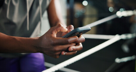 Fitness, man hands and phone in boxing ring for contact, training schedule or typing message on...