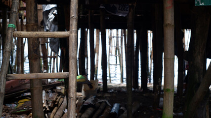 The basement of the stilt houses built by the Bajau people is built on the cluttered seashore of...