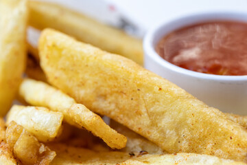 big french fries with ketchup close up