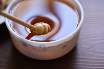 honey dripping from a spoon