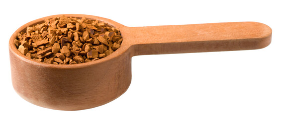 Freeze dried coffee powder in a wooden measuring spoon, isolated on a white background.