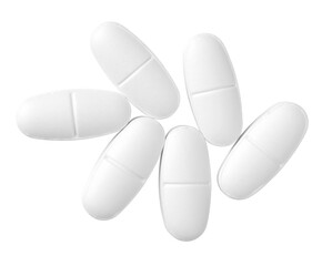 White oval pills isolated on white background, top view.