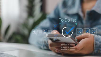 Person holding smartphone with to-do list digital interface overlay, representing task management, goal setting, productivity planning, and modern personal organization tools.