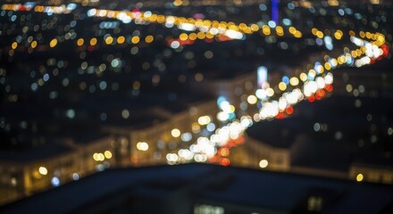 Obraz premium Vibrant blurred city lights and car traffic at night creating a beautiful bokeh effect