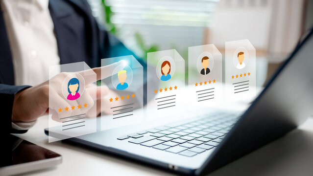 Digital recruitment and talent rating system concept. A businessperson selects candidate profiles with star ratings on a virtual screen, representing modern HR and hiring technology.