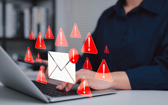 Email security threat and spam warning concept. Person using laptop with red warning icons and envelope representing email threats, phishing, spam alerts, cybersecurity risk in digital communication. - Powered by Adobe