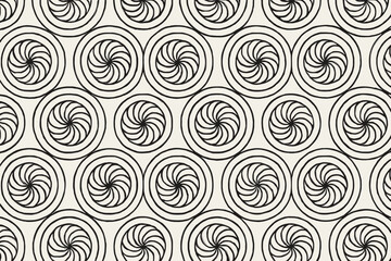 Fototapeta premium A black and white repeating pattern of spirals, creating a hypnotic and dynamic visual effect.