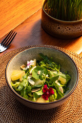 Vibrant Green Salad with Pineapple, Almonds, and Edible Flowers A Healthy and Delicious Meal