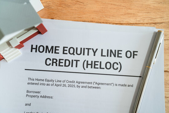 Top view of home equity line of credit contract. Concept of getting HELOC mortgage.