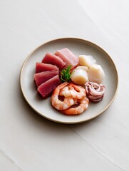 Fresh seafood assortment featuring tuna, shrimp, scallops, and squid on a minimalist plate