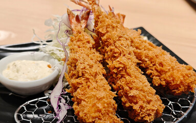 Tempura shrimp on a plate with sauce