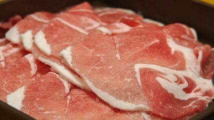 Pork cut into pieces on a square plate