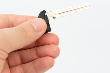 Small metal key in hand