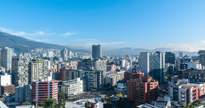 modern buildings in the northern part of Quito in the morning with a blue sky in the background