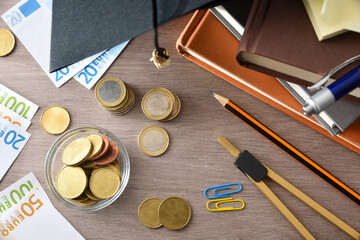 Education spending concept with books money and educational material top