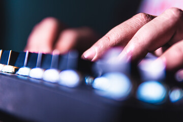 Close-up of fingers typing on a mechanical keyboard with glowing backlight. Ideal for content about...