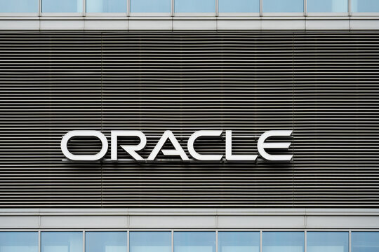 Oracle Corporation logo sign on the Warsaw HUB office building. American multinational computer technology and software company. Signboard with brand logotype on March 24, 2025 in Warsaw, Poland.