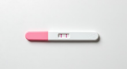 Positive pregnancy test on white background indicating pregnancy with two lines
