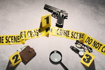 Forensic expertise. Crime scene with evidence, markers and police tape on light grey background,...
