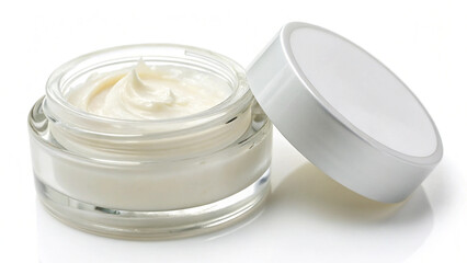 Creamy white cosmetic product in a transparent pot, with its silver-rimmed lid, suggesting hydration.